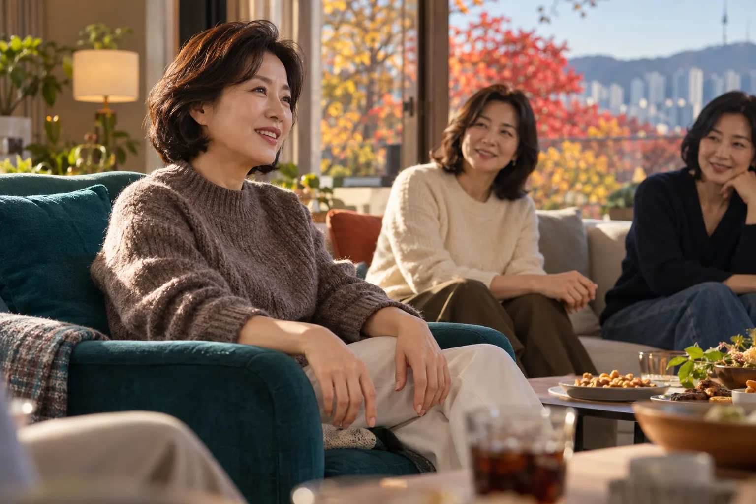 A middle-aged woman smiles in an armchair while chatting with friends in a sunlit living room.